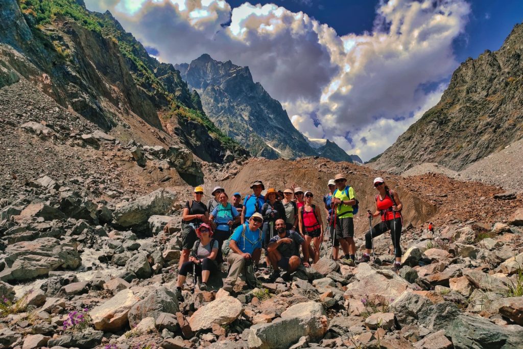 Hikers in a rocky Caucasus mountain valley in Svaneti, Georgia
